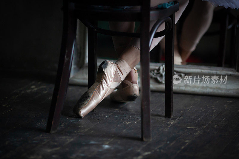 Legs of a ballerina in pointe shoes